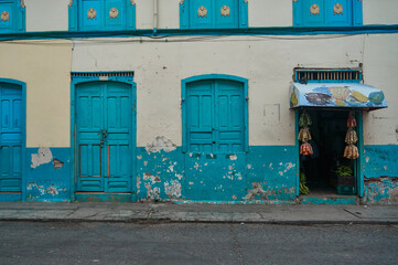 Naklejka premium Vegetables shop front in Pijao, Quindio, Colombia.