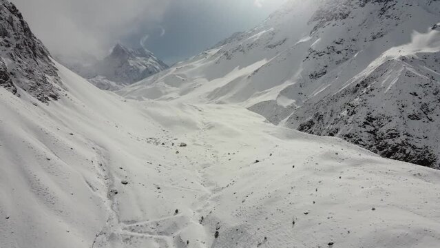 Trekking in winter season. Snowed mountains in La Egorda Valley, Caj n del Maipo, central Andes mountain range, Chile 