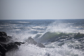 Ocean waves crashing on a rocky shore