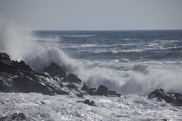Ocean waves splashing on a rocky shore