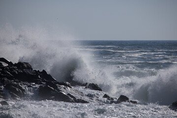Ocean waves splashing on a rocky shore