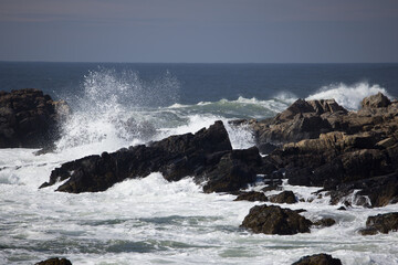 Ocean waves splashing on a rocky shore
