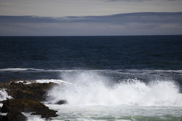 Ocean waves crashing onto a rocky shore