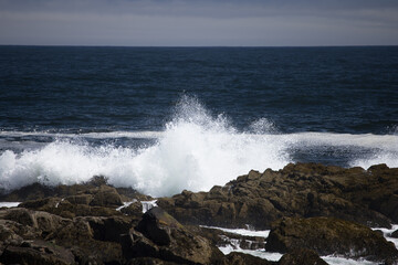 Ocean waves crashing against a rocky shore