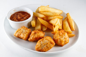 Chicken nuggets, chips, baked beans
