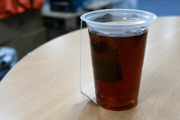 Hot tea in a clear glass in the morning