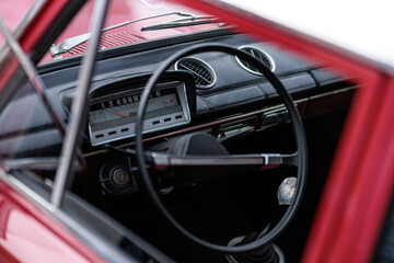 Fototapeta premium dashboard, car interior, automatic tachometer of an old red car