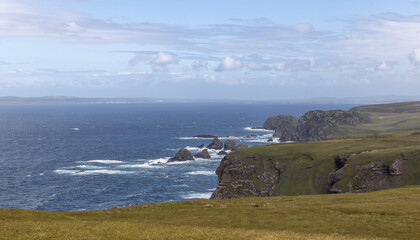 Rugged cliffs and coastline on the western side of the Isle of Islay, Scotland.