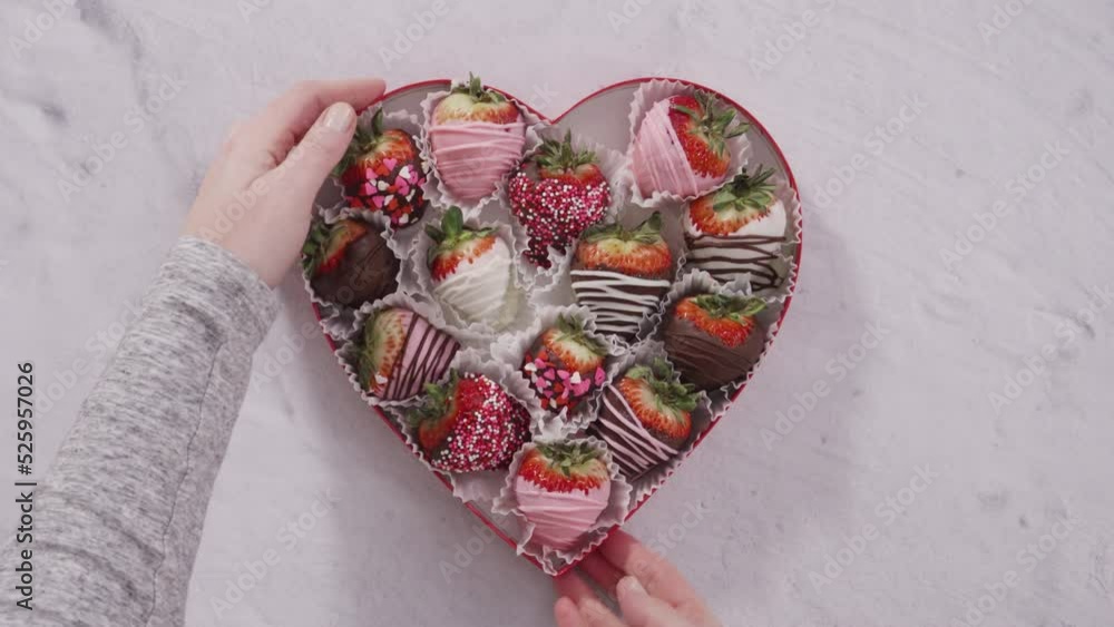 Sticker flat lay. step by step. heart-shaped box with chocolate dipped strawberries.