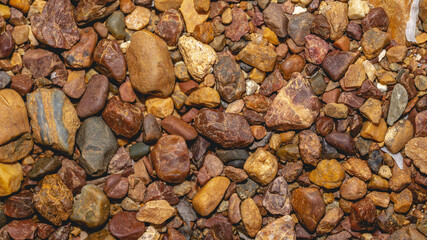 Abstract nature pebbles background. Brown pebbles texture. Stone background. Natural seamless stone texture background