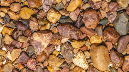 Abstract nature pebbles background. Brown pebbles texture. Stone background. Natural seamless stone texture background