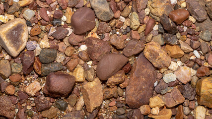 Abstract nature pebbles background. Brown pebbles texture. Stone background. Natural seamless stone texture background
