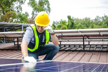 Asian technicians install panels Solar cells to produce and distribute electricity. Energy technology concept.