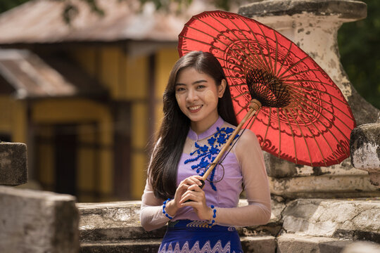 Myanmar woman in Burmese traditional dress at Shwenandaw Kyang monastery in Mandalay Myanmar