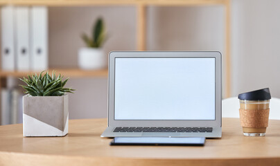 Mockup laptop, coffee and tablet on desk at home office of freelance SEO, UX or digital social media marketing and advertising freelancer. Internet or online work from home remote workspace