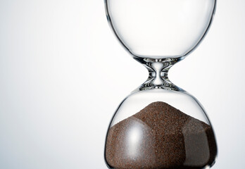 An hourglass placed on a white background.