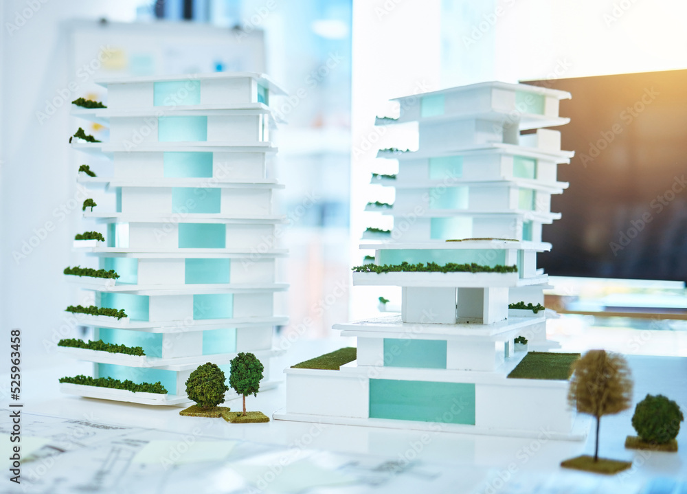 Poster building real estate model on a table in an architecture or construction business office. creative 3