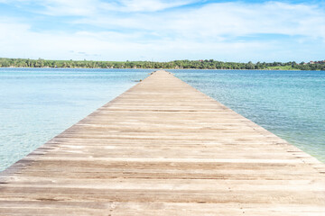 The wood floor extends into the sea. space for product or object presentation 