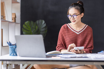 Freelancer Business Asian woman working in the workplace with documents on her desk, doing planning analyzing the financial report, business plan investment, finance analysis concept