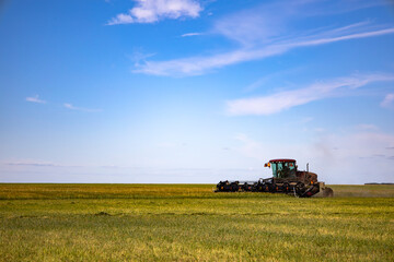 Agricultural machinery in operation in the fields. A new trend in technology.