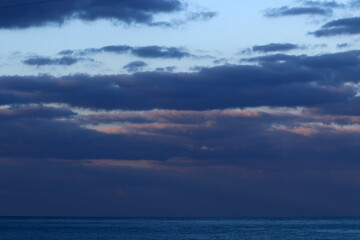 Naklejka na ściany i meble Clouds in the sky over the Mediterranean Sea.