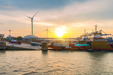 Yangtze River port wharf and wind turbine and sunset scenery in Jiangyin City, China