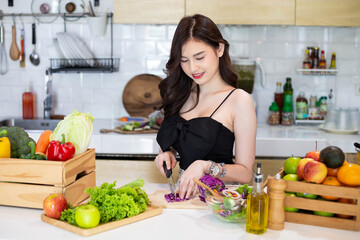 Beautiful Asian Woman smiling preparing vegetable salad in the kitchen Healthy FoodsVegan SaladsVegetarian SaladFood IdeasDiet IdeasHealthy LifestyleCooking At Home