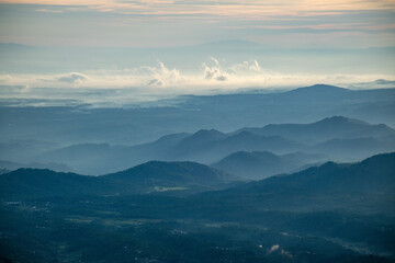 Fototapeta premium Sunrise at the peak of Si Kunir in the Dieng Plateau, Wonosobo, Central Java Indonesia 