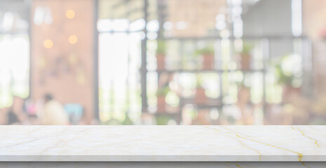 Obraz na płótnie Canvas marble table top with blurred kitchen cafe restaurant interior background