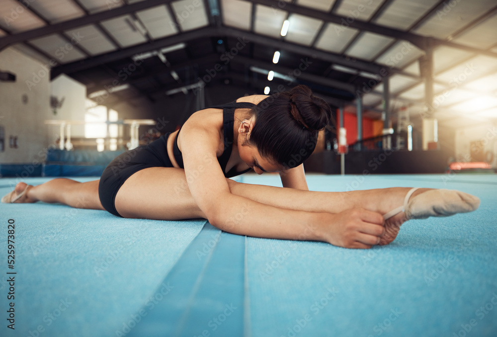 Canvas Prints Sports woman stretching on the floor in yoga splits in a gym. Young fitness girl or athlete legs in training, workout exercise or cardio with motivation, wellness and commitment for a competition