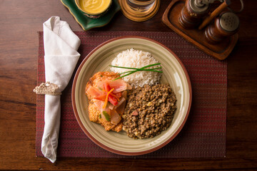 Escabeche fried fish with onions and lentils stew white rice Buffet table Peruvian comfort restaurant gourmet food