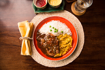 Fried cow liver with locro pumpkin stew Buffet table Peruvian comfort restaurant gourmet food