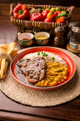 Fried cow liver with locro pumpkin stew Buffet table Peruvian comfort restaurant gourmet food