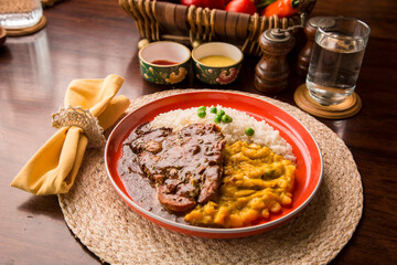 Fried cow liver with locro pumpkin stew Buffet table Peruvian comfort restaurant gourmet food