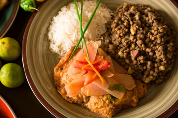 Fish escabeche onion lentils and rice Peruvian comfort restaurant gourmet food