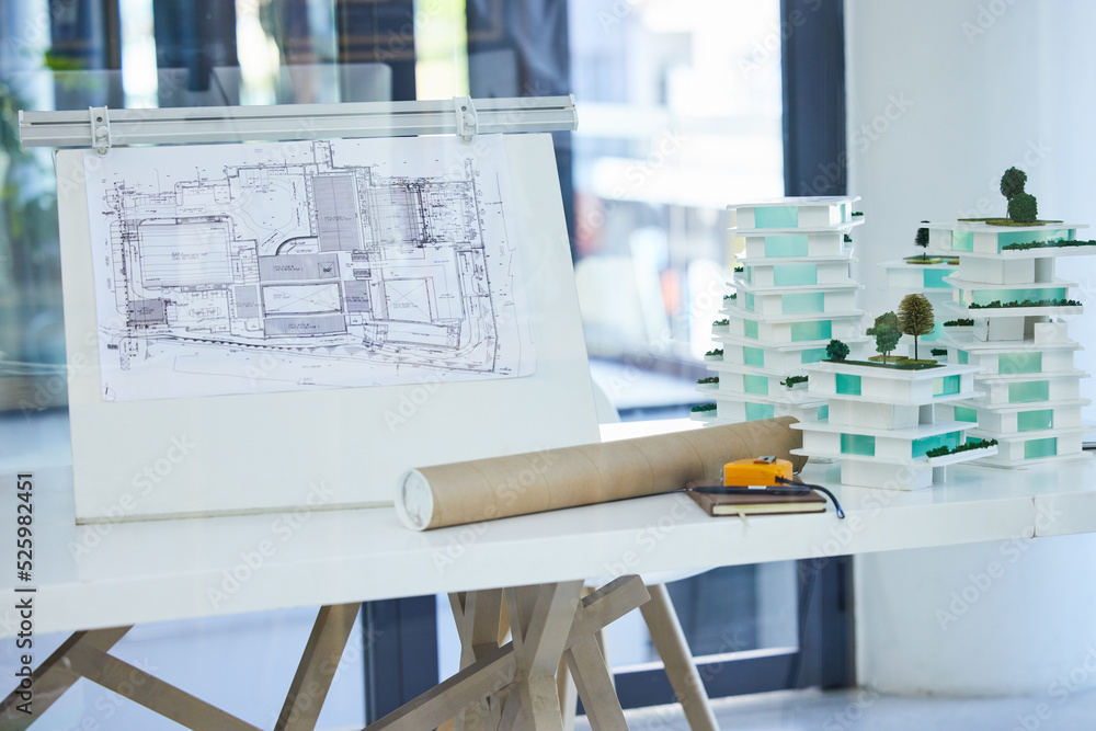 Fototapete Architecture, design and blueprints on an office desk with plans and a building model for the construction industry. Architect office, planning and equipment in a modern and creative workplace