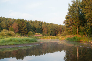 Fototapeta na wymiar River in nature on a summer day, early in the morning