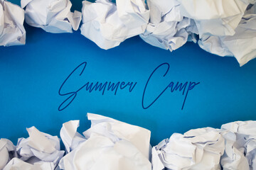 Summer Camp text with Torn, Crumpled White Paper on colored background.