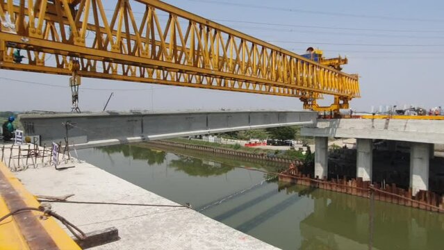This is the steel structure of a launcher gantry that will be used for erection precast concrete I Girder across the river.