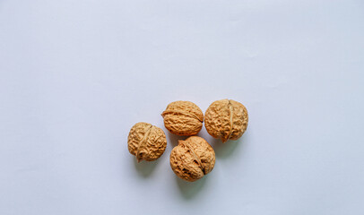 Group of dried walnuts on white background.