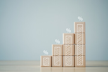 Interest rate finance and mortgage rates concept. Wooden blocks with growth of bar chart percentage...