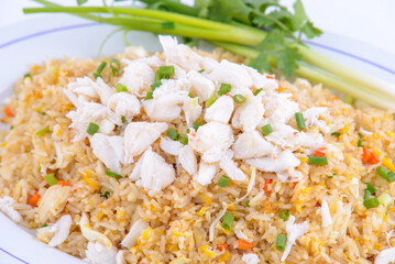 Crab fried rice on the white dish.