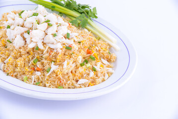 Crab fried rice on the white dish.