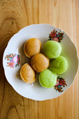 Kue Apem is Indonesian traditional snack, made from rice flour, coconut milk, and sugar. Selective focus