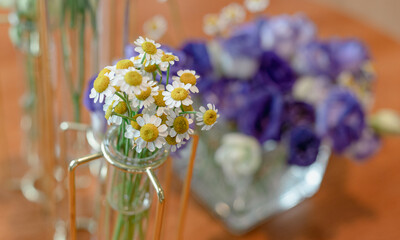 bunch of white and yellow flowers on table