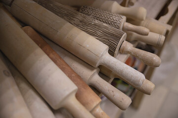 Wooden rolling pins for rolling clay and making pottery and utensils. Tool for pottery. A set of rolling pins for drawing a picture on clay for dishes with a handmade pattern.