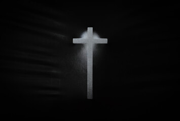 The cross pressing through black fabric with shine and dark side for Halloween background concept.