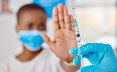 Vaccine hesitancy, covid and female patient stopping doctor from giving the injection at the...