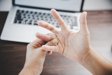 Arthritis person, finger woman ache from working in office. Concept office syndrome hand pain from...