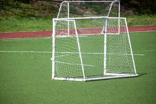 Old football goal on the field.
